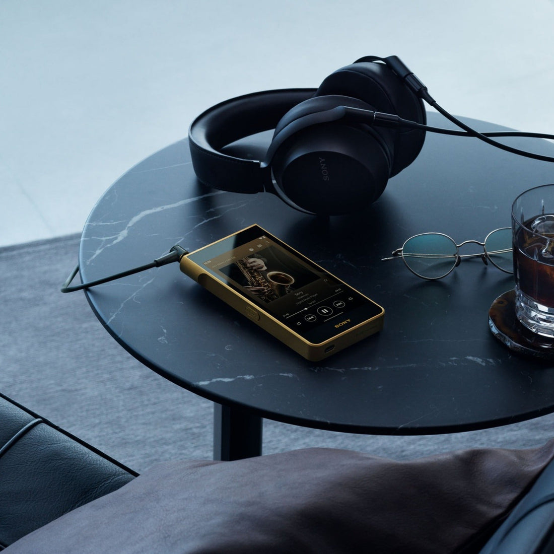 Sony NW-WM1ZM3 Walkman on a black marble table with headphones