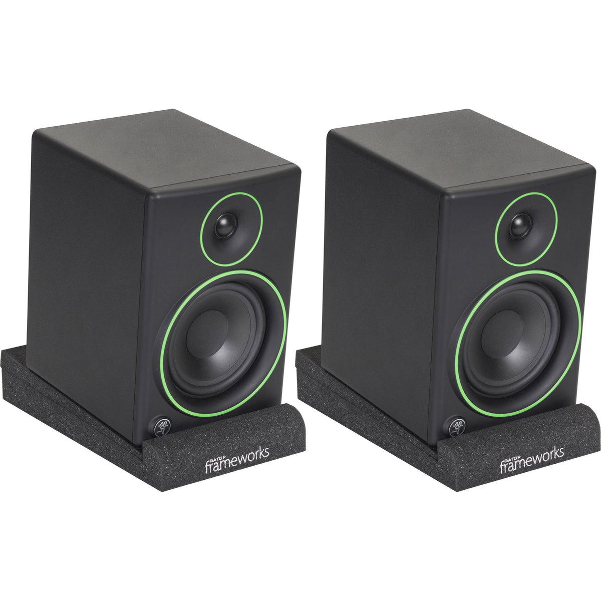 Gator Studio Monitor Isolation Pads placed on studio monitor stands, designed to reduce vibrations and improve sound quality.
