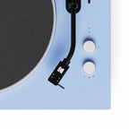 Kanto Audio OBI3 Gen 2 turntable, Ice Blue, close-up of tonearm and start/speed buttons