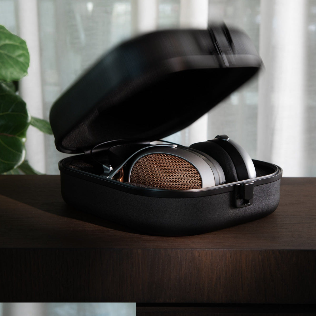 Wired Meze Audio Poet headphones with over-ear design, black cushions, and sleek cables for immersive listening.